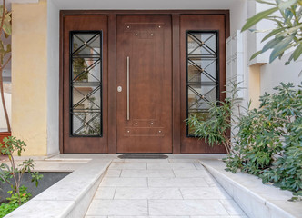 Fototapeta na wymiar Elegant apartments building wood and glass door, Athens Greece