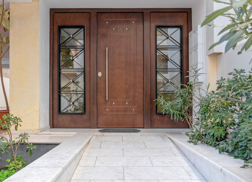 Elegant apartments building wood and glass door, Athens Greece