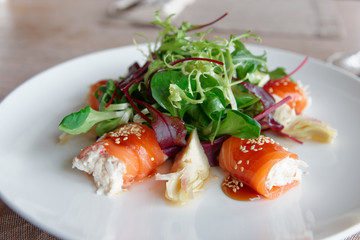 Salmon roll with crab meat stuffing, close-up
