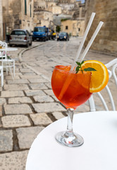 A refreshing aperol spritz in one of the cafes in Sassi di Matera, the historic district of Matera, Basilicata. Italy