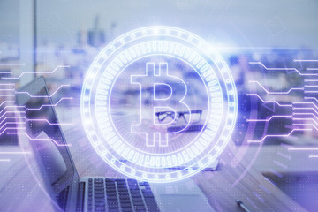 Double exposure of blockchain theme hologram and table with computer background. Concept of bitcoin crypto currency.