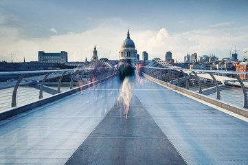 motion blur of people walking on millennium bridge in London 