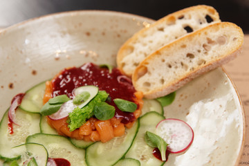 Salmon tartare with cucumbers and red sauce