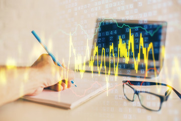Multi exposure of man hands with stock market forex graph.