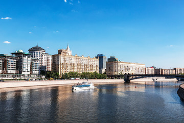 View of the Moscow river, Smolensk embankment, Smolensk metro bridge and a tourist ship floating on the river. Moscow, Russia