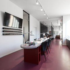 Interior of empty modern nail salon. Workplaces for masters of manicure