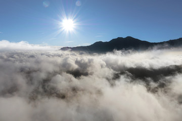 Snowdonia National Park aerial view with cloud inversion below covering the mountains