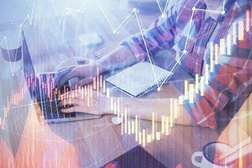 Multi exposure of forex graph with man working on computer on background. Concept of market analysis.
