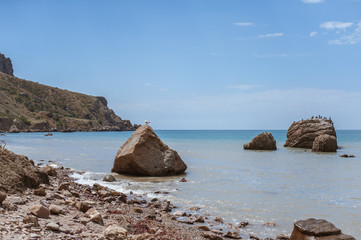 Fototapeta na wymiar Meganom mountain range and beach, as well as the peninsula and cape in southeastern Crimea