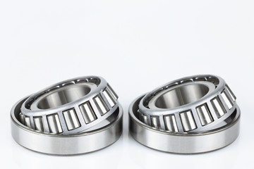 Close-up Tapered Roller bearings spare part of mechanical on the white background..