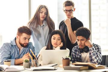 Serious groupmates searching information for their project