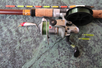  spinning with a reel with a wobbler and a float. Preparing for spring fishing.