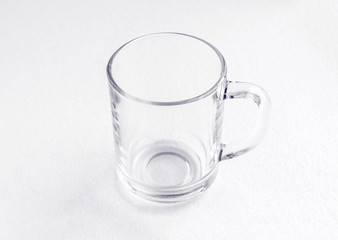 clean glass transparent empty teacup on white