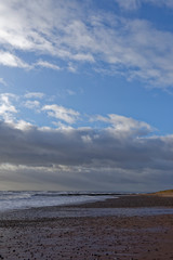 Easthaven Beach on the East Coast of Scotland at Low tide with high winds and seas brought on by Storm Dennis.
