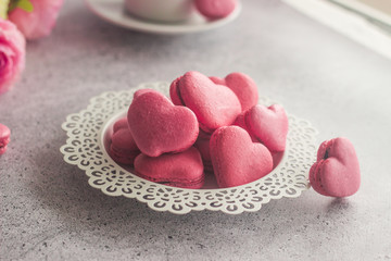 Macaroons. Delicious french dessert. Macaroons are made in the shape of a heart. Romantic composition. Great for Valentine's day or romantic design.