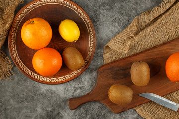 Tropical fruits on a rustic background. Top view.