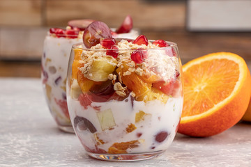 Fruit with yogurt and granola in a glass. Tasty and healthy breakfast