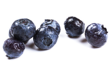 a handful of blueberries close-up isolated on white background