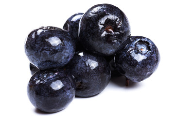 a handful of blueberries close-up isolated on white background