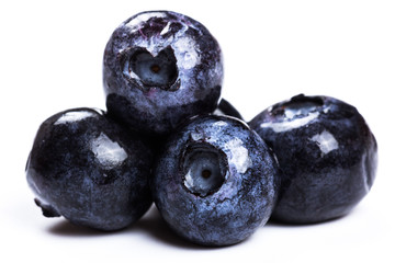 a handful of blueberries close-up isolated on white background