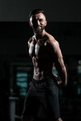 Fototapeta na wymiar Portrait Of A Fitness Muscular Man