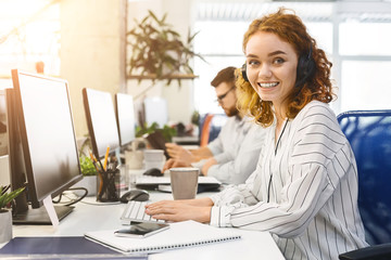 Young business woman working at call center office