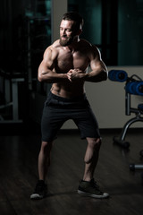 Obraz na płótnie Canvas Bodybuilder Performing Most Muscular Pose