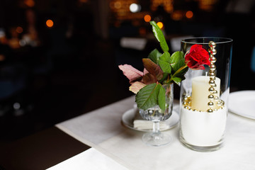 flower fold on tables and a glass with candles, table decor