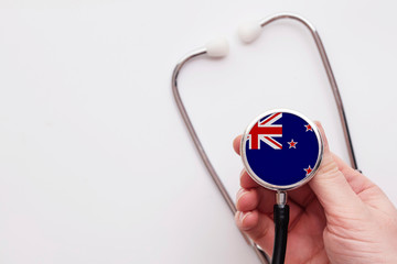 New Zealand healthcare concept. Doctor holding a medical stethoscope.