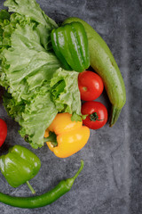 Green vegetables with tomatoes and bell peppers. Top view.