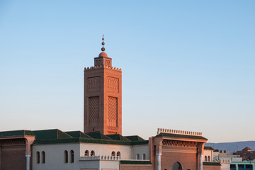 Red minaret of the Great Mosque in Oujda in the evening with clear blue sky
