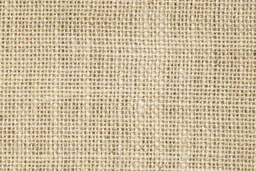 Hessian sackcloth burlap woven texture background/cotton woven fabric background with flecks of varying colors of beige and brown. with copy space. office desk concept. Hessian sackcloth burlap woven.