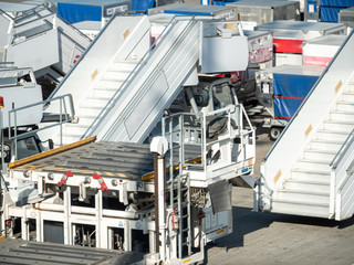 Image of empty boarding ladders and stairways in airport waiting for airplane arrival