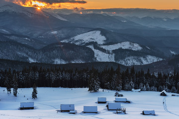 Wonderful morning in the mountainous valleys with houses in the Ukrainian Carpathians.	