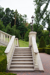 Stone ancient stairs with in a park.garden. Marble stairs