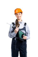 Woman builder with saber saw in her hands smiling. Isolated