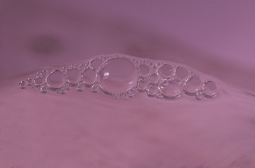 original colorful background with foam on the water surface