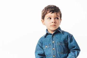 cute boy in denim shirt looking away isolated on white