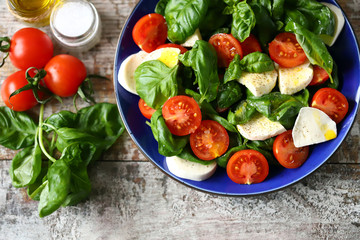 Obraz na płótnie Canvas Healthy bright caprese salad with cherry tomatoes. Diet concept.