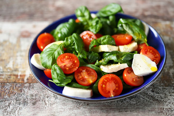 Healthy bright caprese salad with cherry tomatoes. Diet concept.