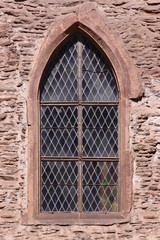 Simple pointed ogive arch of a gothic window at St Nicholas church in Vianden, rural Luxembourg