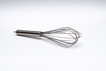 Whisk in a white background