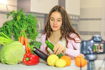 Teenage blogger explains to her followers how to eat healthy. Concept of communication among young people on the importance of healthy eating habits, vitamins and calories.