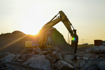 Crawler excavator with hydraulic breaker hammer for the destruction of concrete and hard rock at...