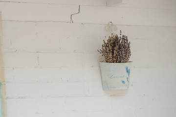 White bricks wall with dry lavender