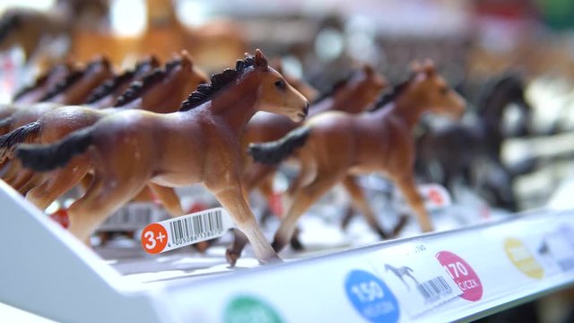 A display of small toys of horses.