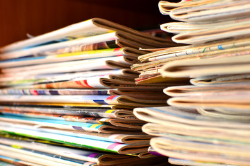 Extensive collection with a lot of glossy multi-colored magazines. Periodicals, official publication journalism concept, receiving news and latest information, background, texture