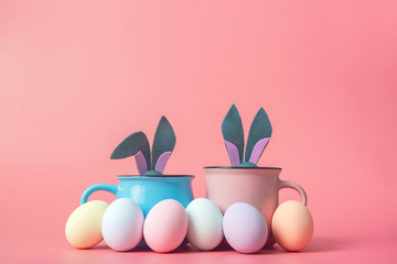cute and cute easter background with circles from which the ears of the easter bunny peek out next to the easter eggs