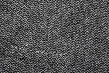 Fototapeta na wymiar Fragment of a woolen vest with a pocket. Close-up