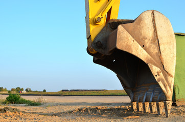 Large metal iron ladle. Excavator bucket for digging a pit and pipeline ditch at a construction...